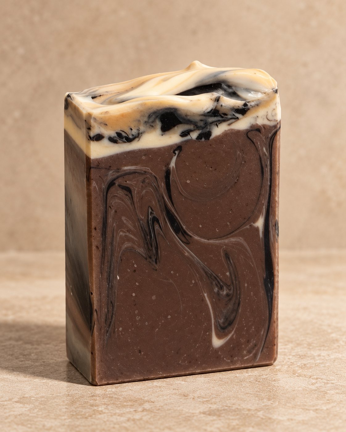 Unlabeled Espresso Macchiato bar, mauve-brown with black and cream swirls and a whipped top