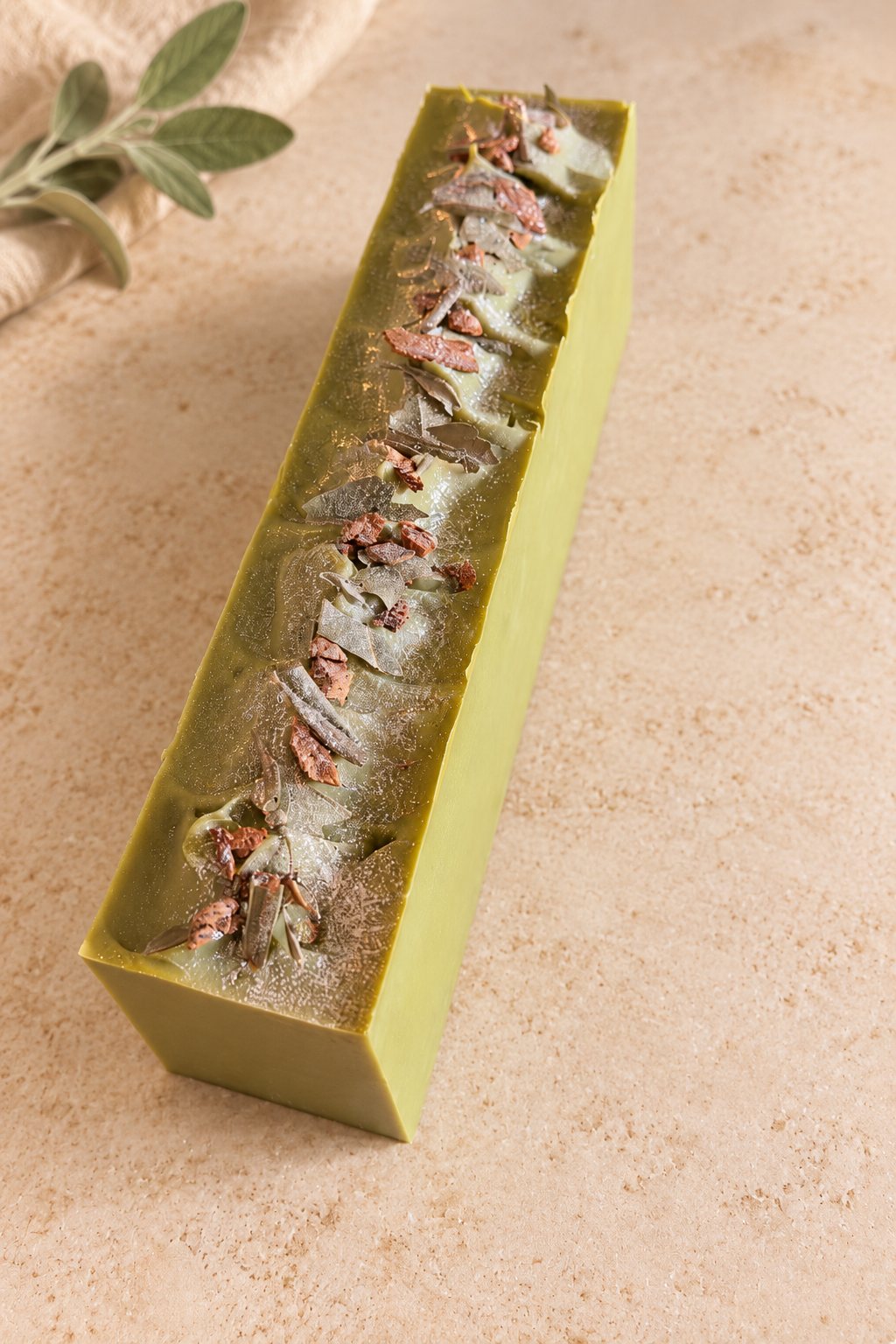 Uncut Honey Spiced Pear loaf, olive green with dried leaves and spice scattered along the top