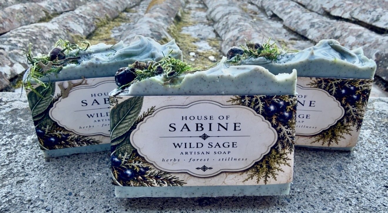 Three Wild Sage bars with juniper and moss tops in House of Sabine botanical labels, on old roof tiles